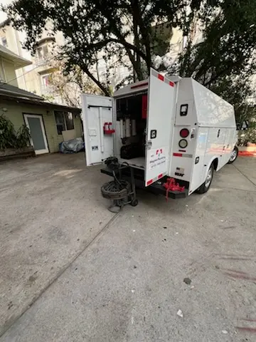 Magnet Plumbing service vehicle on-site for Grease Trap Cleaning in West Palm Beach Farms